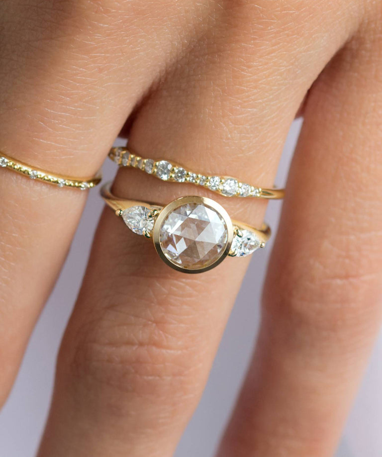 A Melanie Casey model wearing an Ascent Ring in Rose Cut paired with a Reverb Ring.