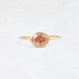 Photo features a Formation Ring, 1.15ct. Lab-Grown Orangey-Pink Diamond on a textured white background.