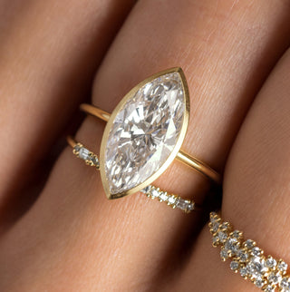 Photo features the Formation Bezel Engagement Ring in Marquise Cut on a model's hand.