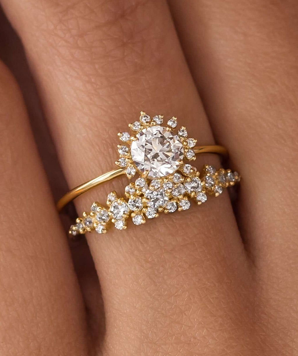 Photo features a model wearing the Melanie Casey Harbor Ring with a 0.7ct. Round Cut Natural Champagne Diamond as the center stone.