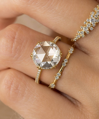 Photo showcases a mode wearing the Moonlit Ring, Rose Cut.