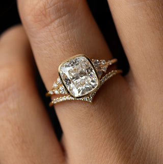 Model wearing the Melanie Casey Snowdrift Bezel Set Ring with a Cushion Cut center stone.