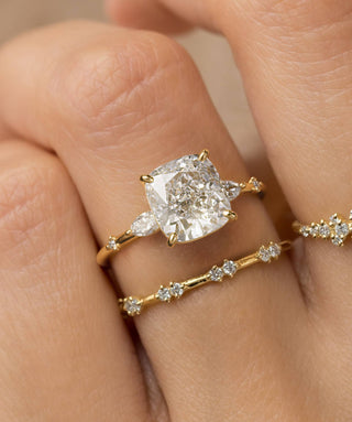 Model wearing the Melanie Casey Windlass Ring with a Cushion Cut center stone.