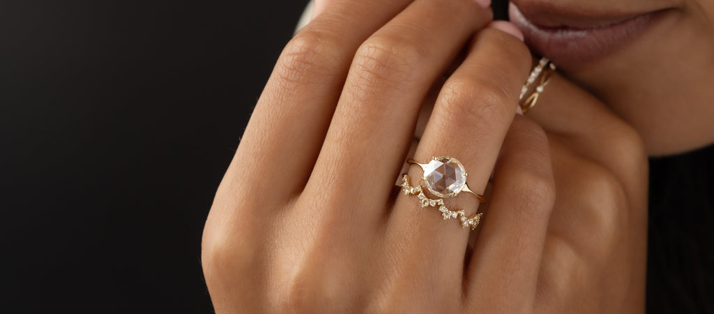 Photo features a model wearing a Corset Ring in Rose Cut