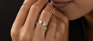 Photo features a model wearing a corset ring in rose cut