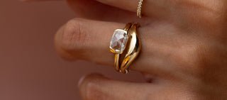 Model wearing the Stanza Ring, 0.94ct. Lab-Grown Cushion Rose Cut in front of a brown background.