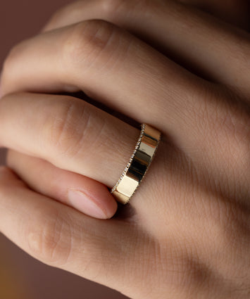 Photo showcases a model wearing the Melanie Casey Breakthrough Men's Band on his hand.