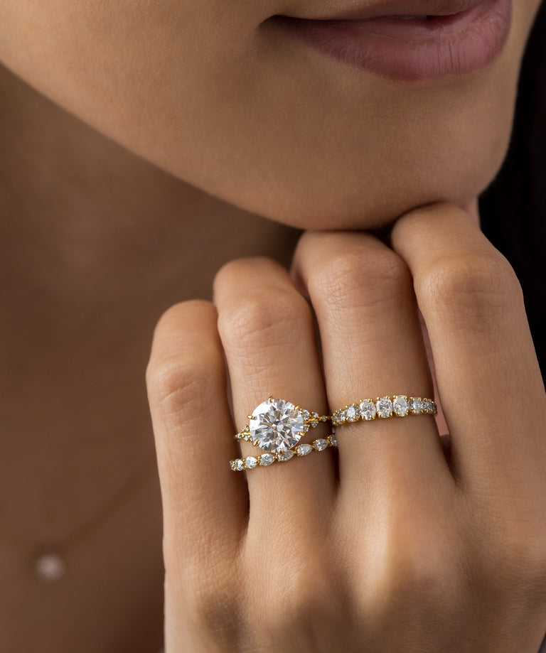 Melanie Casey model wearing the Snowdrift Ring in Round Cut Diamond and Yellow Gold.