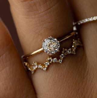 Photo features a model wearing the Melanie Casey Touchpoints Ring, 0.63ct. Natural Diamond.