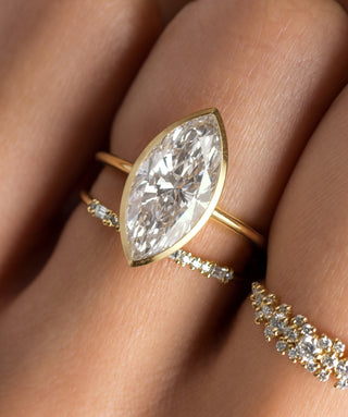 Photo features the Formation Bezel Engagement Ring in Marquise Cut on a model's hand.