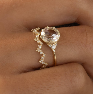 Photo showcases a model wearing the Rose Cut Lady's Slipper Ring.