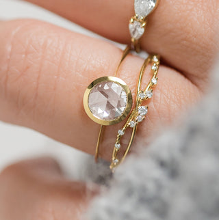 Photo features the Melanie Casey Edifice Bezel Ring worn on a model's hand.