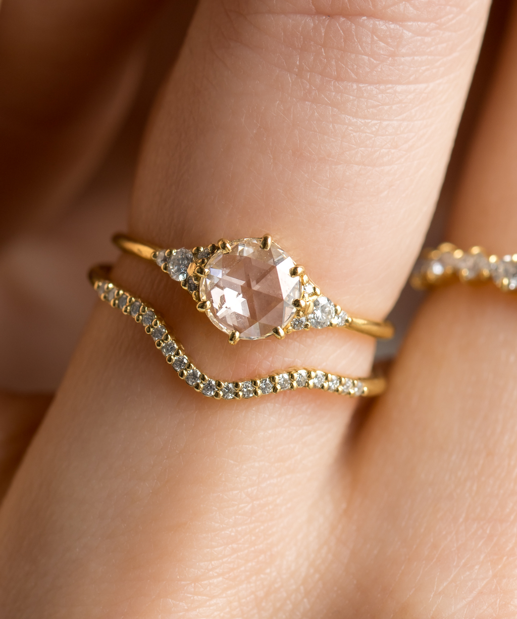 Photo showcases a model wearing the Melanie Casey Lady's Slipper Rose Cut Ring.