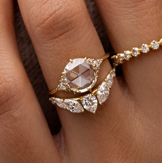 Photo features a model wearing a Round Rose Cut Melanie Casey Engagement Ring.