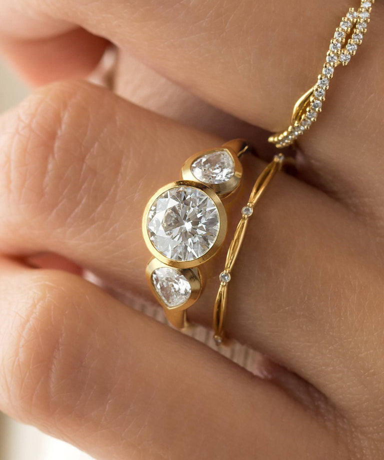 Photo features the Moonrise Engagement Ring in Round Cut on a model's hand.