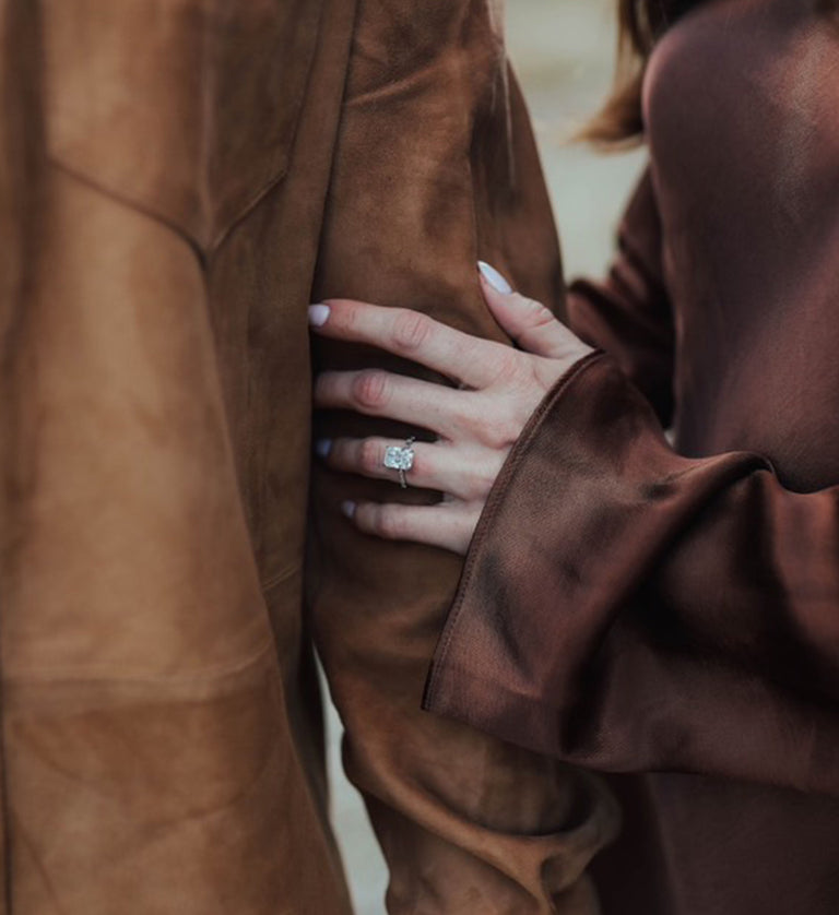 Clarissa L and her fiancé featuring her heirloom reset engagement ring.